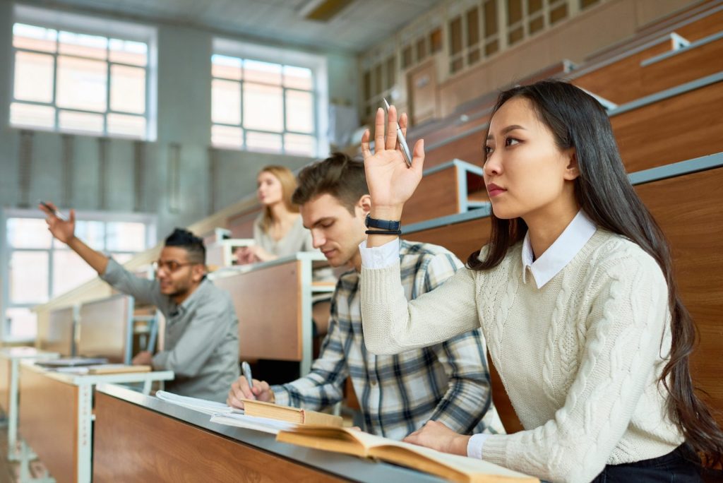 students raising hands in college e1638164822554 1