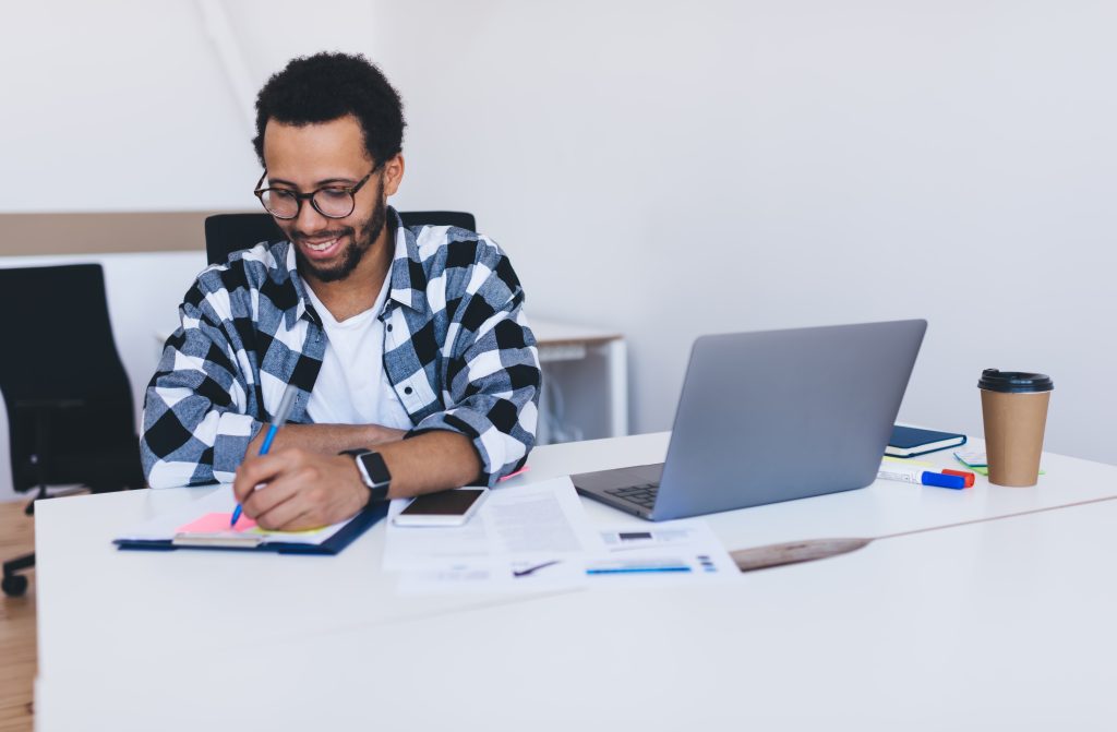 cheerful employee in spectacles editing report str 2023 08 05 03 29 45 utc scaled