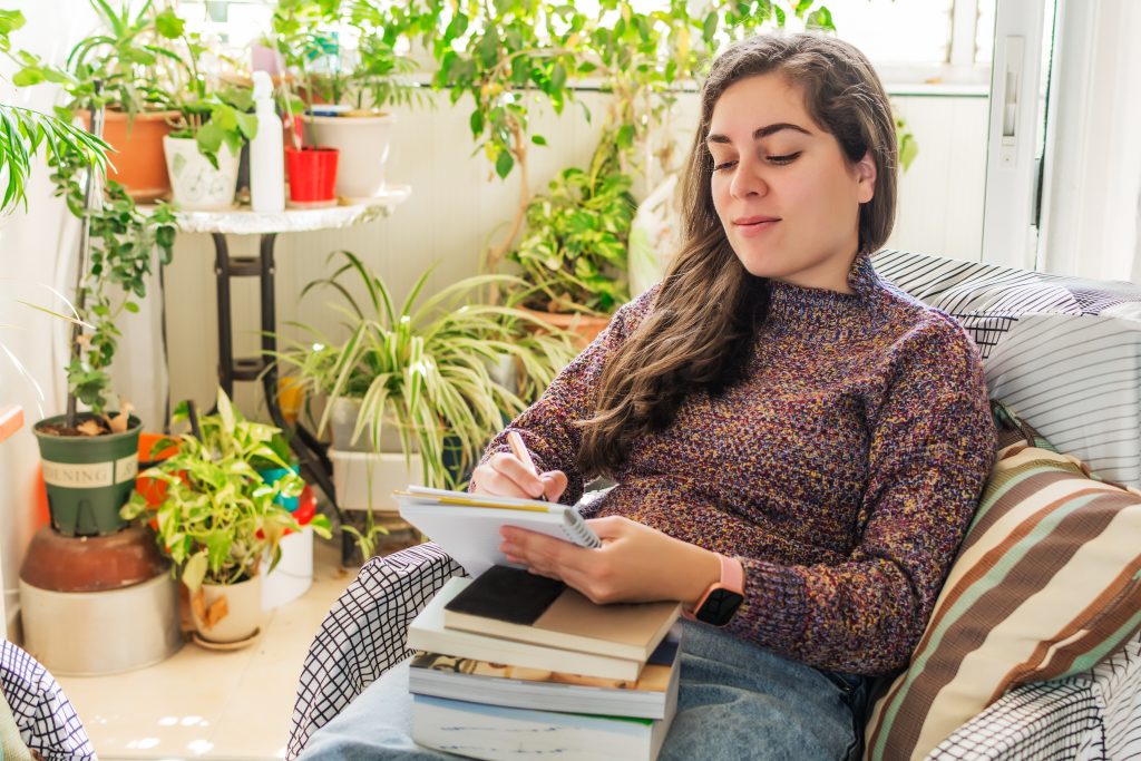 young female studying at home in the cozy living r 2023 05 09 00 05 47 utc scaled